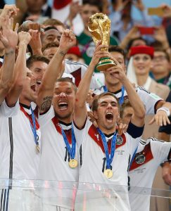 Philipp Lahm (captain) of Germany holds the World Cup trophy aloft during the 2014 FIFA World Cup Final match at Maracana Stadium, Rio de Janeiro Picture by Andrew Tobin/Focus Images Ltd +44 7710 761829 13/07/2014